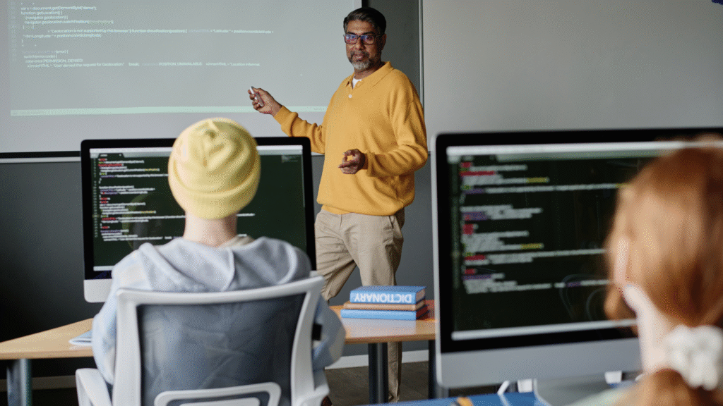 teacher teaching programming to students 
